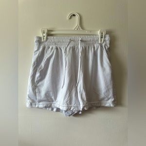 Athletic works white basketball shorts with white lining inside size: medium